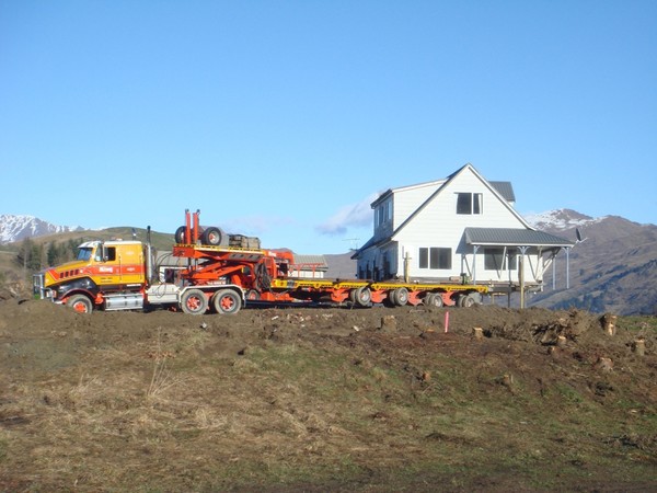 King House removers remove one of the existing houses from the Mill Green development site